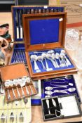 A selection of vintage canteens of cutlery, including bone handled knives and boxed babies spoon and