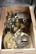 A box of vintage brass ware and similar, including antique coach hub nut, candlesticks, toasting