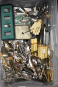 A box full of vintage cutlery, boned handled knives, sugar nips, napkin rings etc amongst this lot.