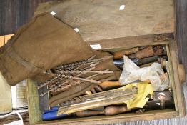 A mixed lot of vintage drill bits and hand tools, sheets of veneer, a rivet spinner and a chain