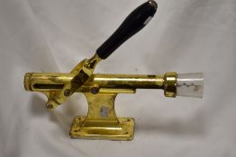 A vintage wall mounted cork screw.