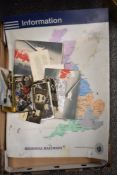 A miscellany of items to include; maps, postcards of isle of man TT, tin soldiers and a railway