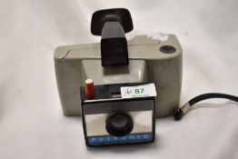 A Polaroid Swinger Sentinal Land Camera