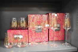 Four stemless wine glasses, four wine glasses and four champagne flutes, all boxed and appear as