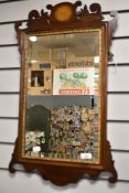 An Edwardian Chippendale style bevelled glass and fret framed mirror having inlaid frame and