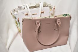 Two David Jones, Paris handbags, including white with floral sides and pale pink, both appear