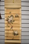 A Chinese paper wall hanging, having hand painted scene of birds and blossom on fabric.
