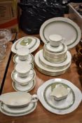 A partial Royal Doulton 'Rondelay' dinner service, comprising; plates, platter, tureen, jug, cups