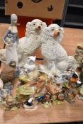 A pair of Staffordshire pottery dogs, assorted Lladro style Spanish studies and figurines and bird