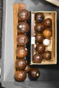 An assortment of vintage wooden carpet bowls/ boules.