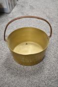 A vintage brass jam pan.
