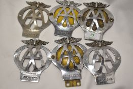 Six vintage AA membership car badges.