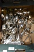 A box of mixed cutlery, including plated ware.