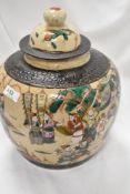 A large reproduction Chinese ginger jar decorated in crackle glaze famille vert with scenes of
