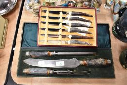 A box of stag horn handled knives and a similar boxed serving set, with steel.