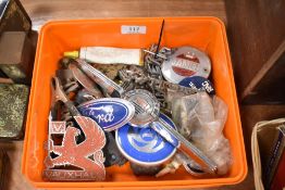 A box of vintage car boot and bonnet badges and similar items, including Morris, Ford and Vauxhall.