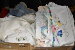 An assortment of mixed vintage table linen, including table and tray clothes and crotched edged