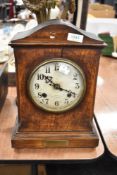 An early 20th century bracket style mantel clock of military interest with oak case and presentation