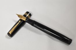A Mabie Todd & Co Swan twistfill fountain pen in black with two narrow and one broad band to the cap