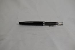 A Peliken Technos cartridge draftsmans pen in black with clear cap. Approx 13.9cm