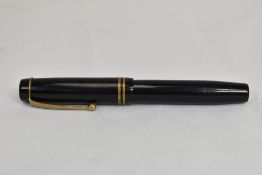 A Parker Duofold Jr Streamlined button fill in black with two bands to the cap having Parker Duofold