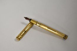 A Mabie Todd & Co Swan leverfill fountain pen gold overlaid engine turned wavy Art Deco pattern