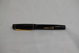 A Croxley lever fill fountain pen in black with single narrow band to cap having Dickenson nib.
