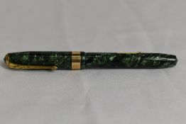 A Conway Stewart 27 lever fill fountain pen in green black hatch with single broad band to the cap