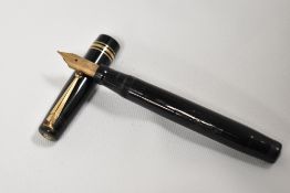 A Mabie Todd & Co Swan twistfill fountain pen in black with two narrow and one broad band to the cap