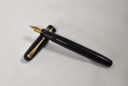A Mabie Todd & Co Swan 3320 leverfill fountain pen in dark blue with three narrow bands to the cap