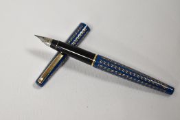 A Lady Sheaffer fountain pen in blue with wavy pattern having Sheaffer nib.