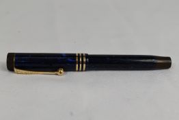 A Parker Duofold Lucky Curve Lady button fill fountain pen blue black with three bands to the cap
