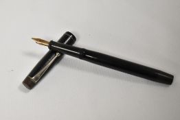 A De La Rue Onoto the pen plunger fill fountain pen in black with engine turn design having De La