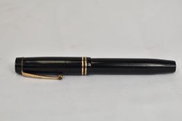 A Parker Duofold Jr Streamlined button fill in black with two bands to the cap having Parker