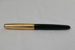 A Parker 51 aerofill fountain pen in forest green with gold filled cap. In good condition some light