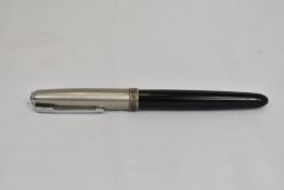 A Parker 51 aerofill fountain pen in black with lustraloy cap. In good condition with additional
