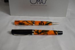 An OMAS (official meccanicco Armando Simoni), Italy, converter fill fountain pen and ballpoint pen