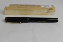 A boxed Conway Stewart 286 lever fill fountain pen in black with single band to the cap having