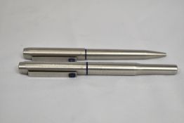 A Parker 25 Flighter converter fountain pen and ballpoint pen set in brushed steel. In good