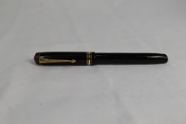 A Conway Stewart 388 lever fill fountain pen in black with one broad and two narrow bands to the cap