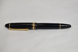 A Montblanc Meisterstuck 146 piston fill fountain pen in black with one broad and two narrow gold