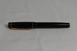 A Croxley 'The Croxley Pen' lever fill fountain pen in black with single band to cap having