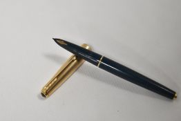 A Parker 61 fountain pen in dark green with rolled gold cap. Fair condition some age related rubbing