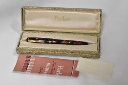 A De La Rue Onoto the pen leverfill fountain pen in rose and black marble with two narrow bands to