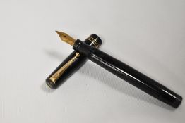 A Mabie Todd & Co Swan 1060 twistfill fountain pen in black with three narrow bands to the cap