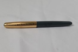 A Parker 51 aerofill fountain pen in navy grey with rolled gold cap. In good condition but engraved