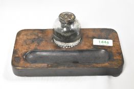 A treen desk tidy with glass ink bottle
