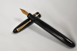 A Mabie Todd & Co Swan 4460 twistfill fountain pen in black with two narrow and one broad band to