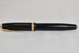 A Parker Duofold button fill fountain pen in black with single decorative band to the cap, twin