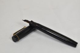 A Parker Duofold Jr Streamlined button fill in black with two bands to the cap having Parker Duofold